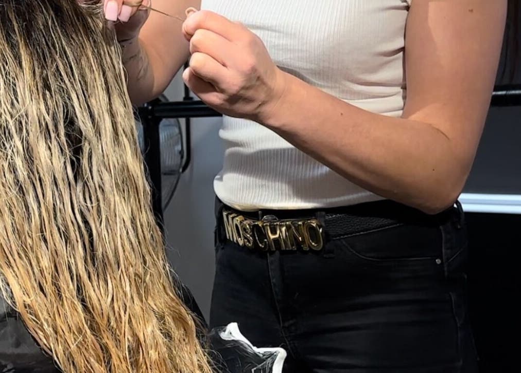 Stylist working on hair at Keratin House, Littlehampton, England, GB, showcasing expert hair care.