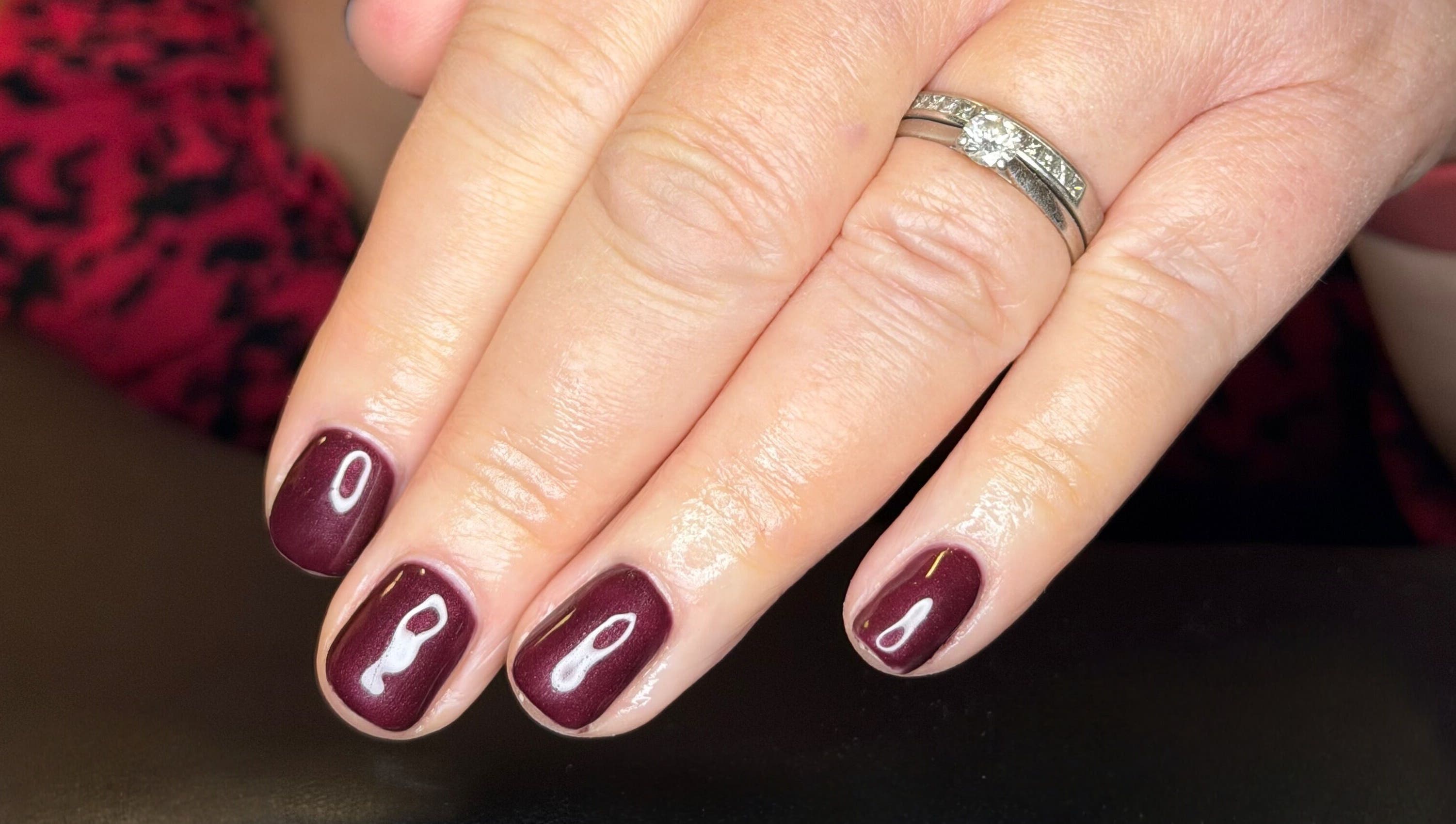 Elegant burgundy manicure at The Balcony, Sowerby Bridge, England, GB. Perfect for a chic and polished look.