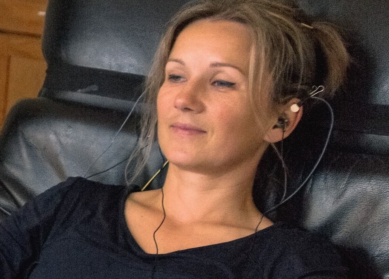 Woman enjoying relaxation therapy at RigaBrain in Rīga, LV.