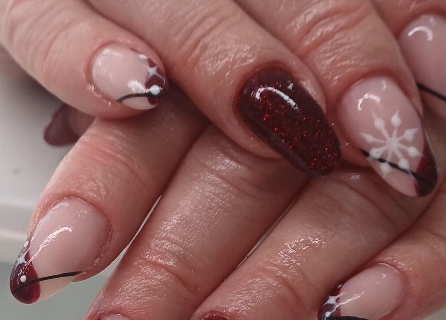 Elegant winter-themed nail art at Glamtouch by Kasia, Birmingham, England, GB.