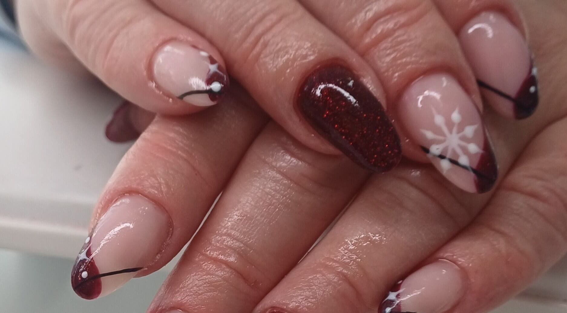 Elegant winter-themed nail art at Glamtouch by Kasia, Birmingham, England, GB.