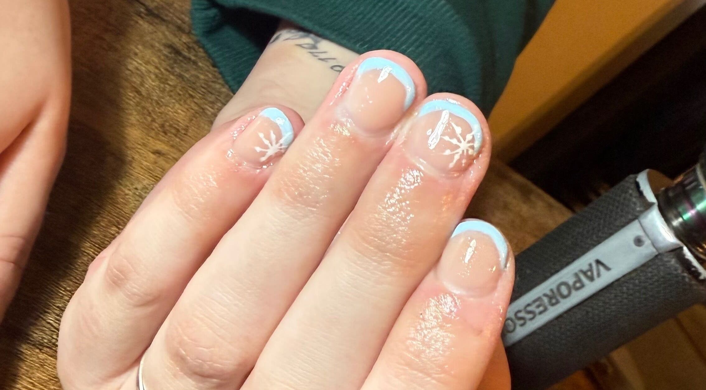 Elegant winter-themed nails at MK Nails & Beauty, Ballymoney, Northern Ireland, GB showcasing delicate frosty designs.