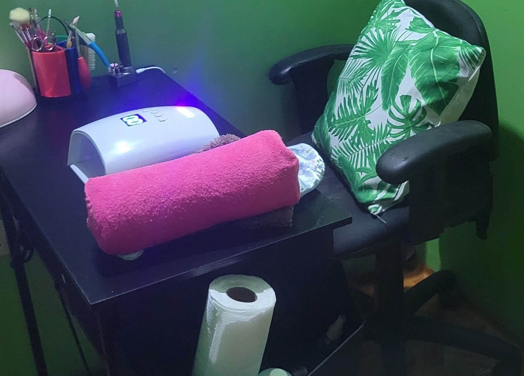 Nail care station at LilysTouch767 in Saint David Parish, DM, featuring a pink towel and nail tools.