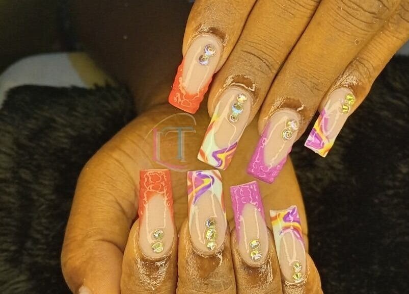 Colorful acrylic nails with gems from LilysTouch767, Saint David Parish, DM.