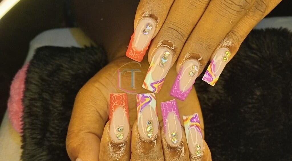 Colorful acrylic nails with gems from LilysTouch767, Saint David Parish, DM.