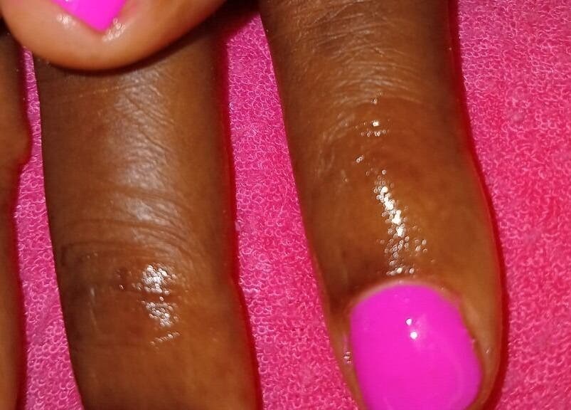 Bright pink manicure at LilysTouch767, Saint David Parish, DM.