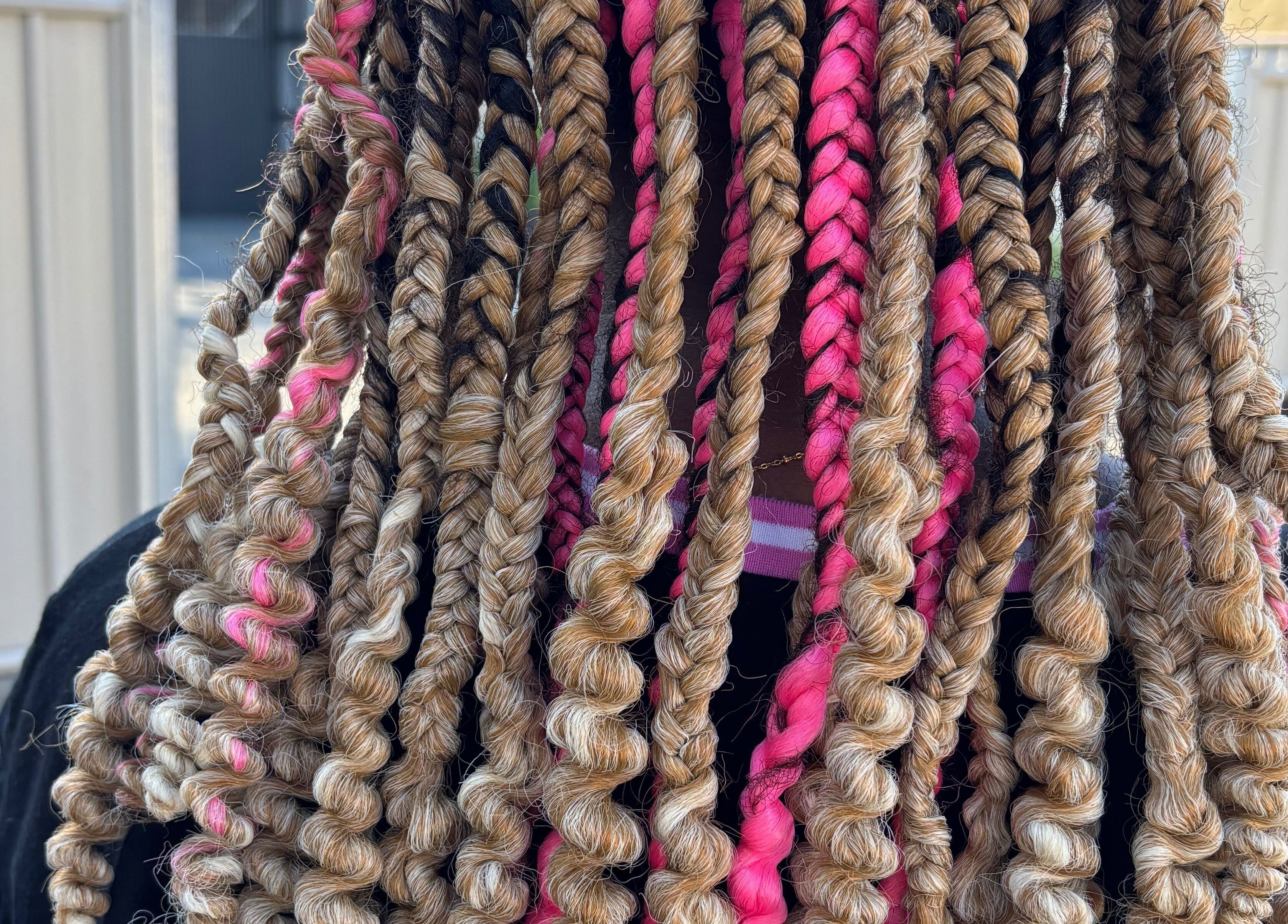 Colorful braided hairstyle at Meme’s Touch in Flagstone, Queensland, AU, showcasing intricate hair art.