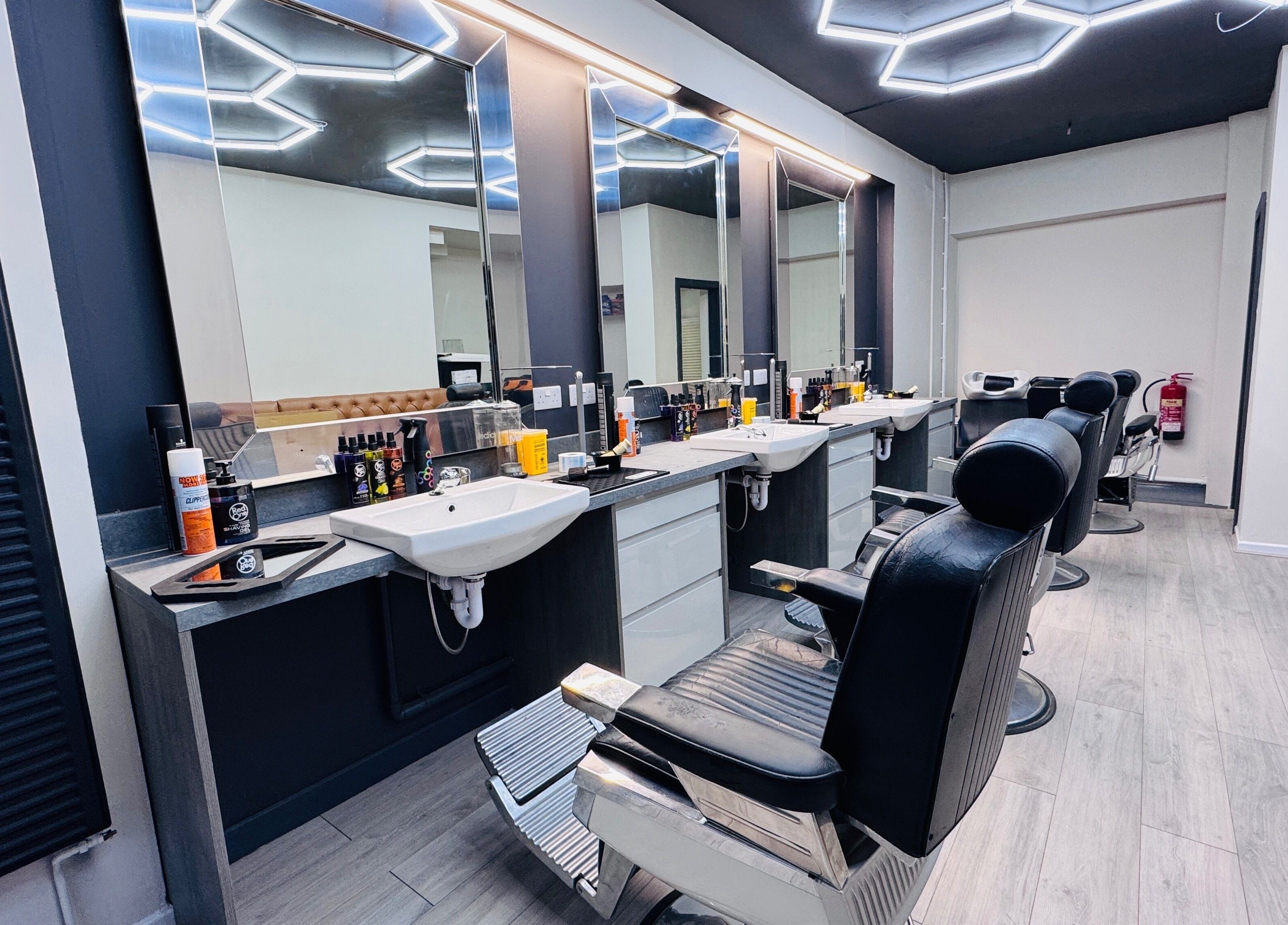 Modern barber chairs at Danny’s Barber, London, England, GB, offering premium haircuts.