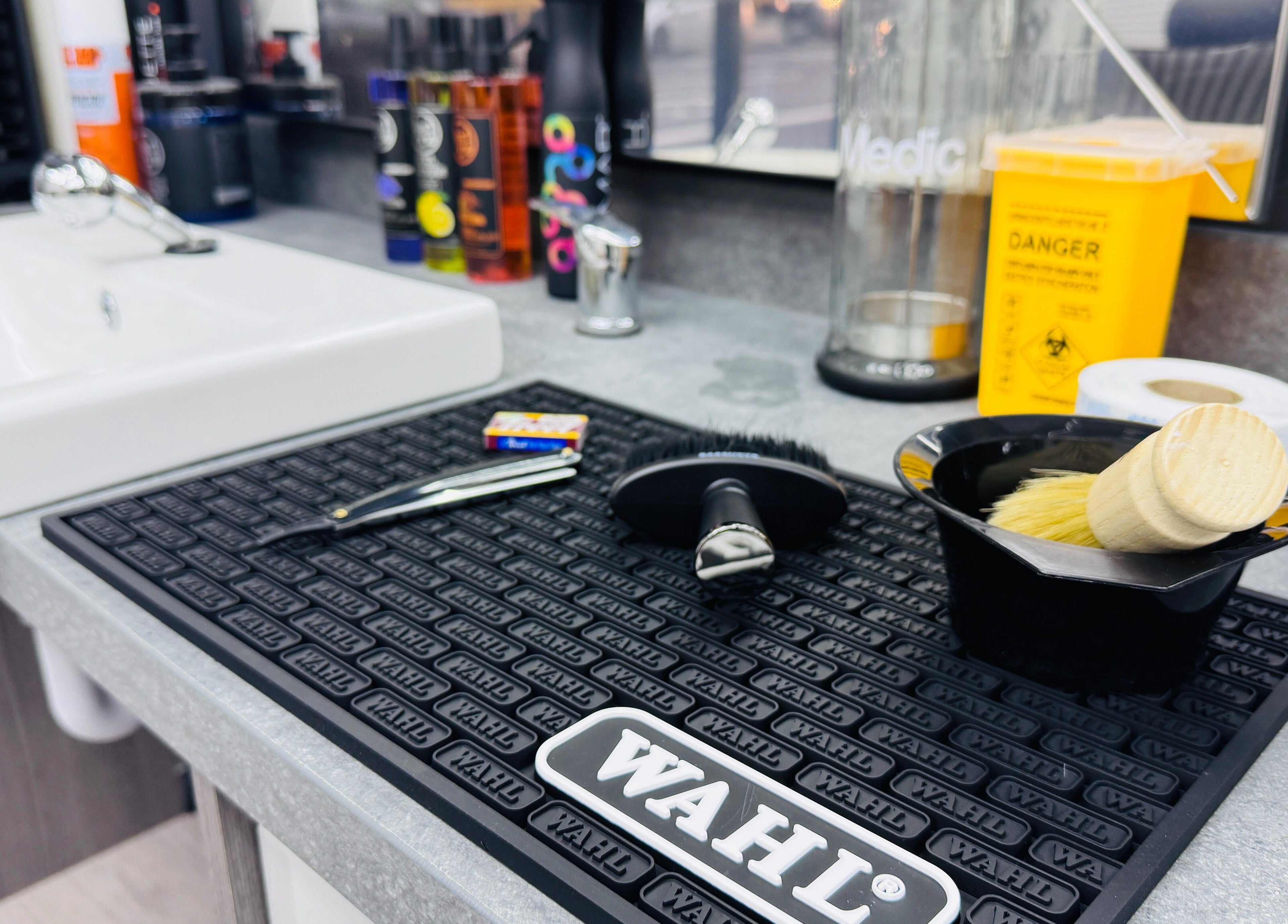 Danny’s Barber grooming tools and sink in London, England, GB. Professional workspace setup.