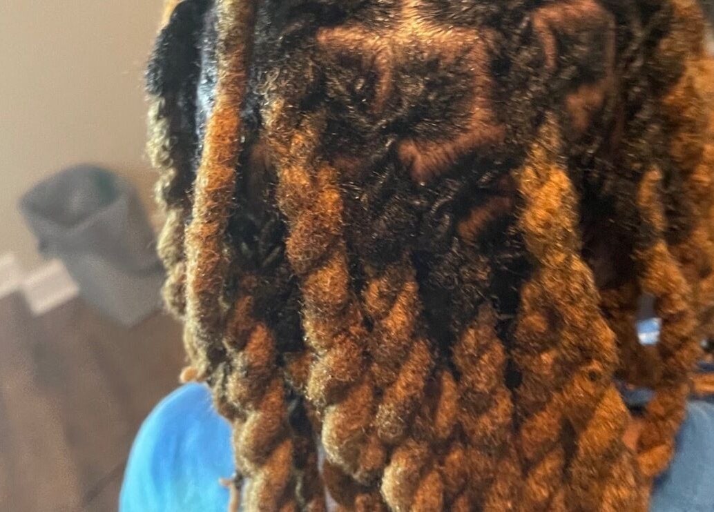 Close-up of beautifully styled dreadlocks at Loc’d With GBaby, Conyers, Georgia, US.