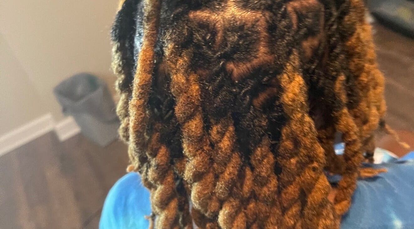 Close-up of beautifully styled dreadlocks at Loc’d With GBaby, Conyers, Georgia, US.