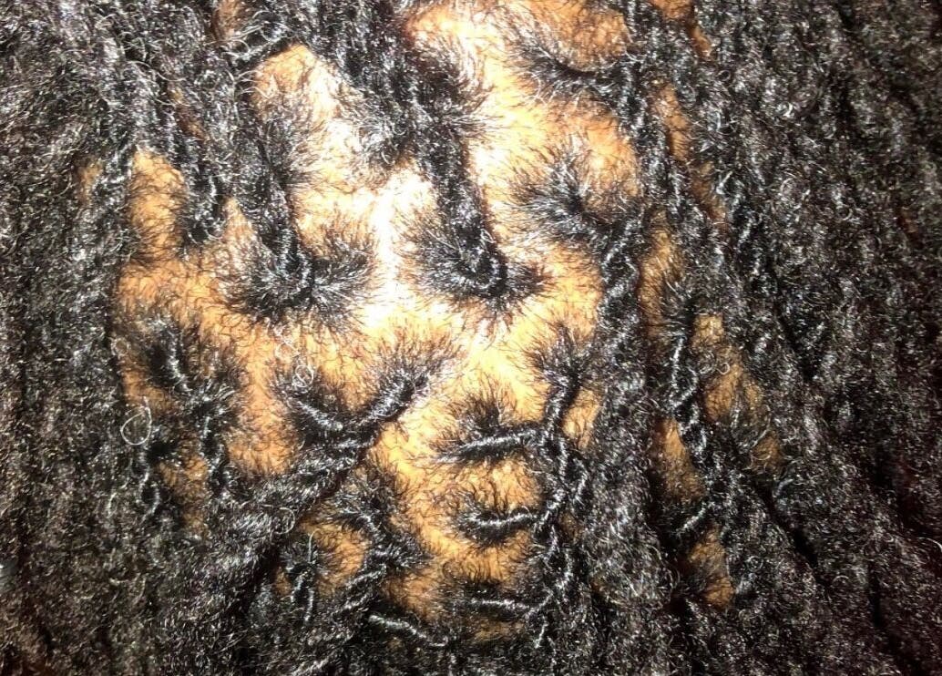 Beautifully styled locs at Loc’d With GBaby in Conyers, Georgia, US, showcasing detailed hair artistry.