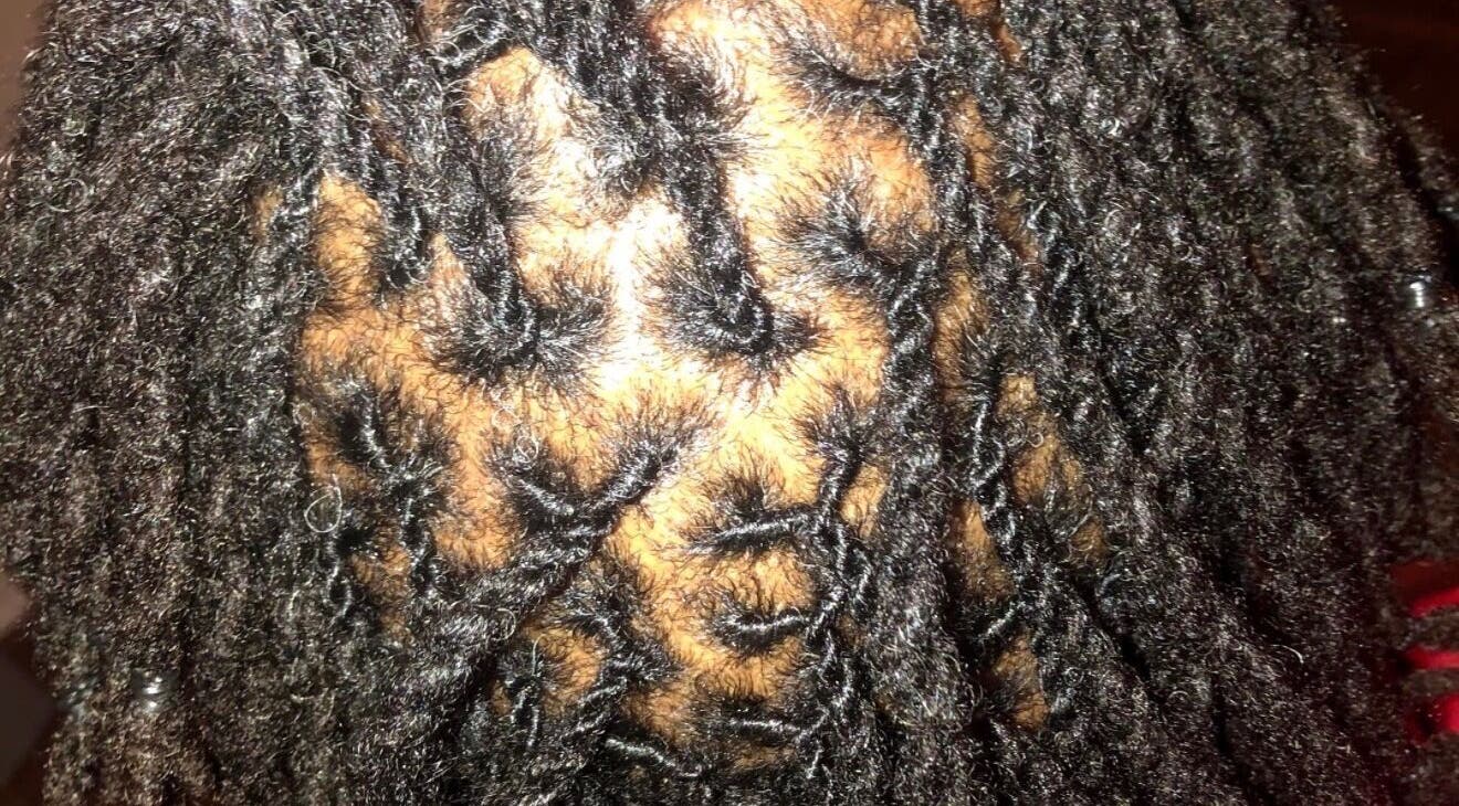 Beautifully styled locs at Loc’d With GBaby in Conyers, Georgia, US, showcasing detailed hair artistry.