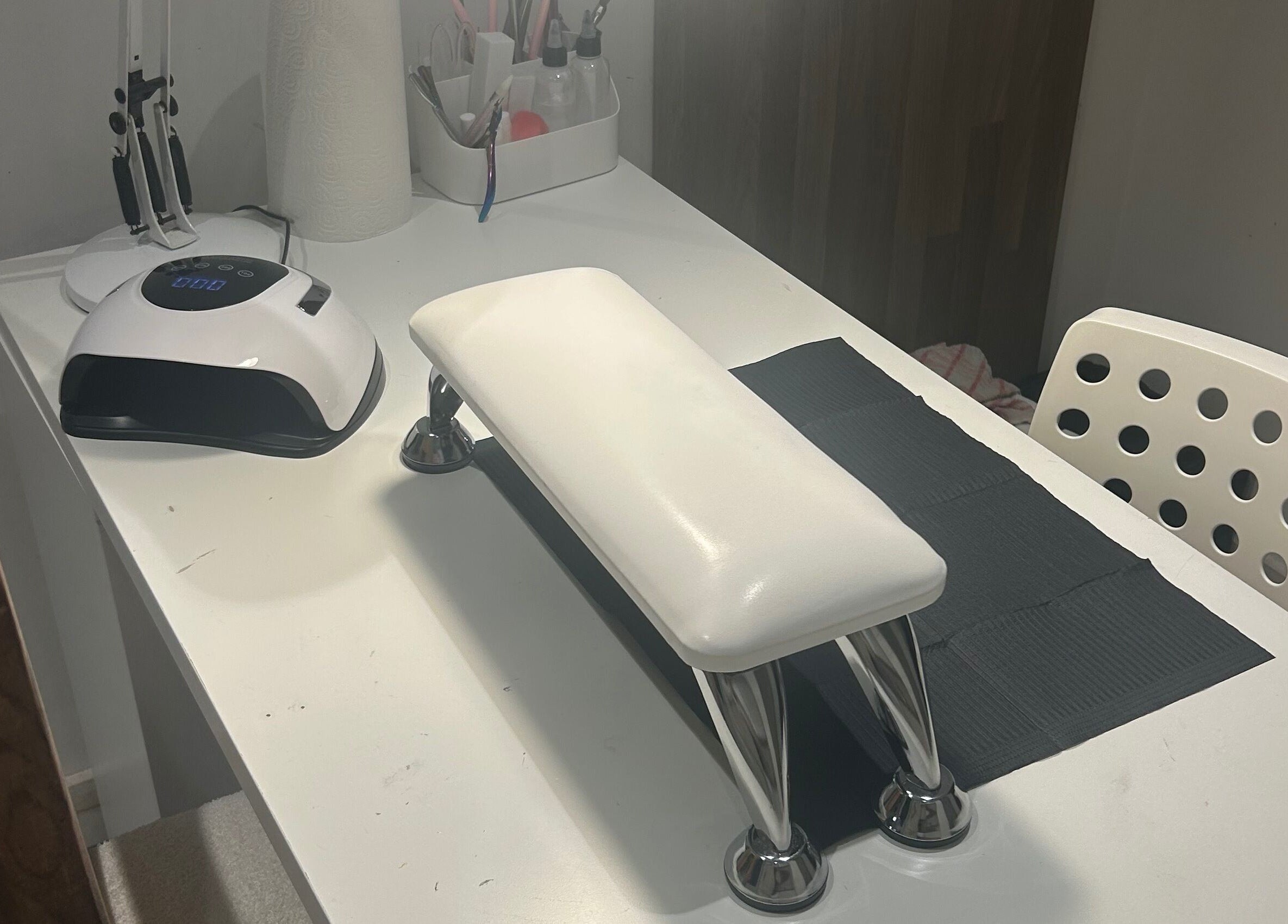 nai.lsbyemilia's sleek nail station in Saint Kew, England, GB, with modern tools and chic decor.