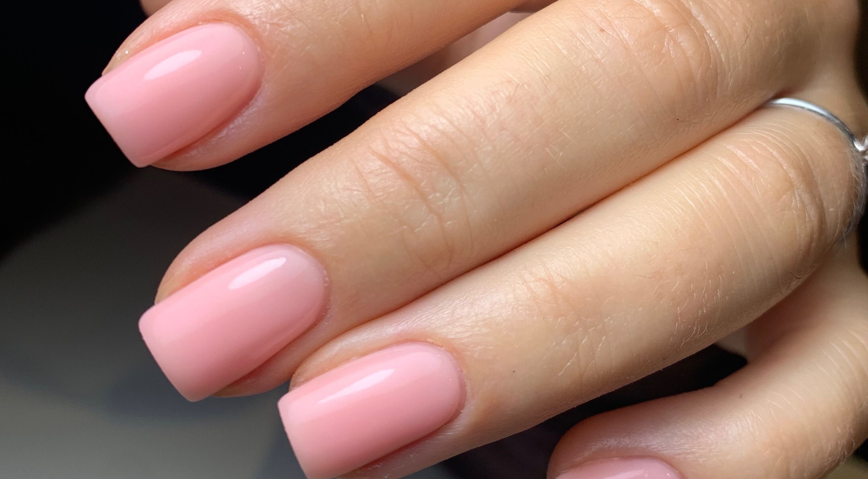 Elegant pink manicured nails at By Tayah, Bristol, England, GB showcasing expert nail care.