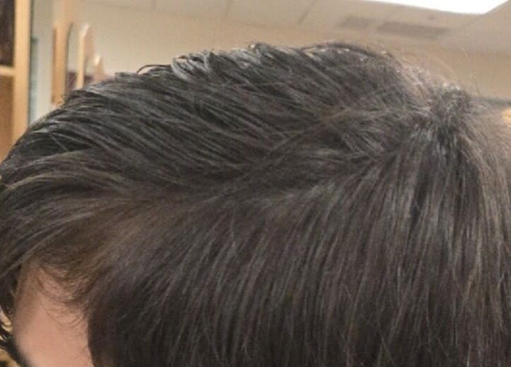 Close-up of a sleek haircut at Serene_Haven_Salon in Texas, Texas, US showcasing expert styling.