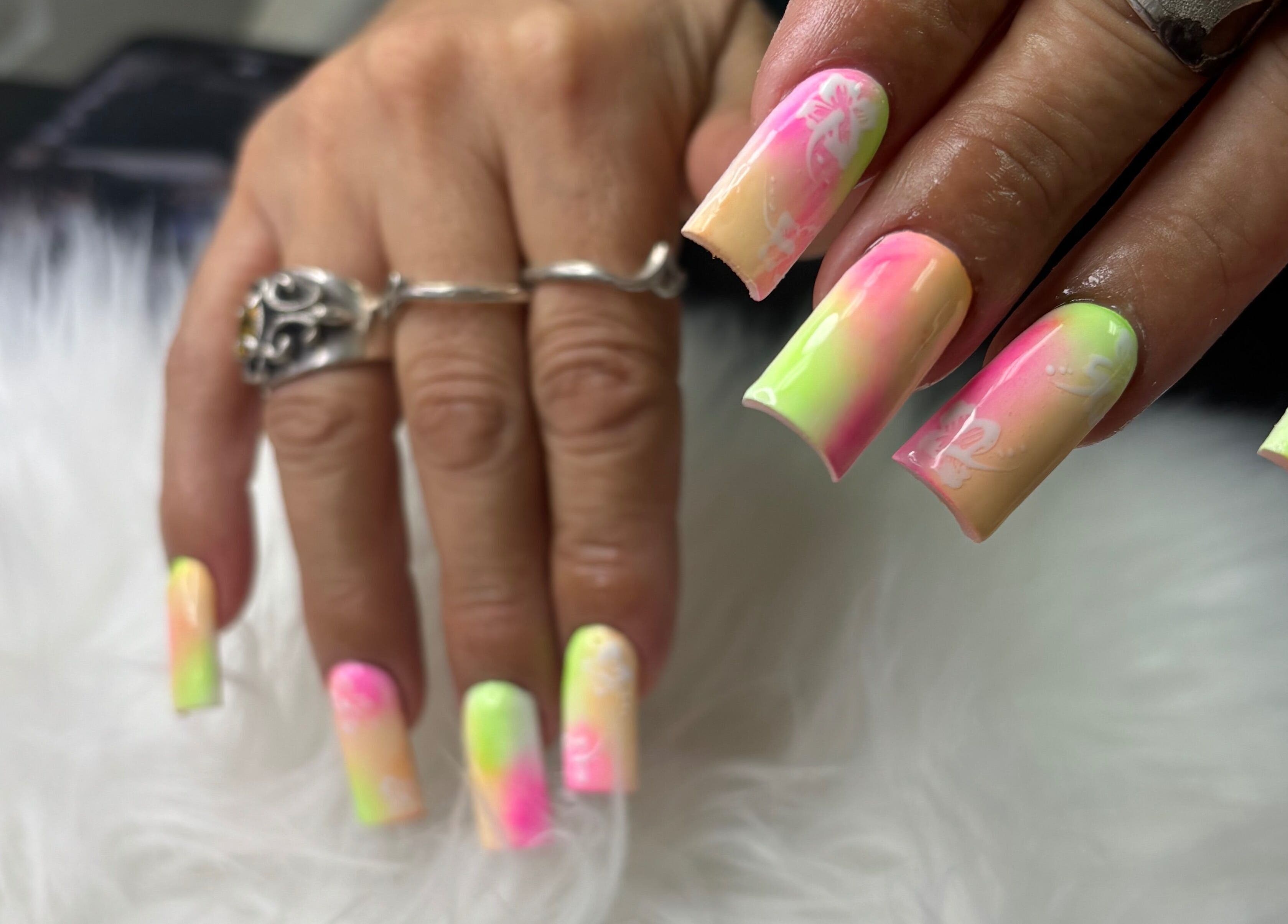 Bright neon nails at Destiny's nail room, San Antonio, Texas, US.