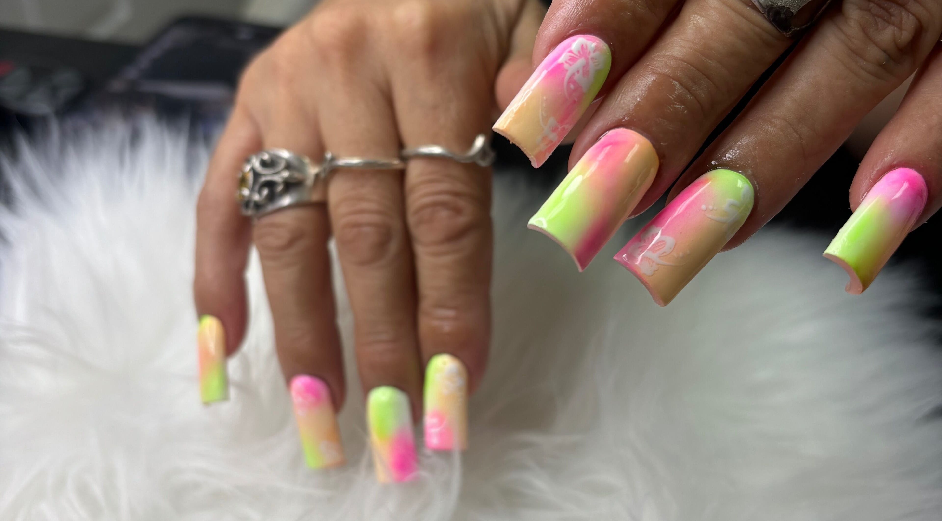 Bright neon nails at Destiny's nail room, San Antonio, Texas, US.
