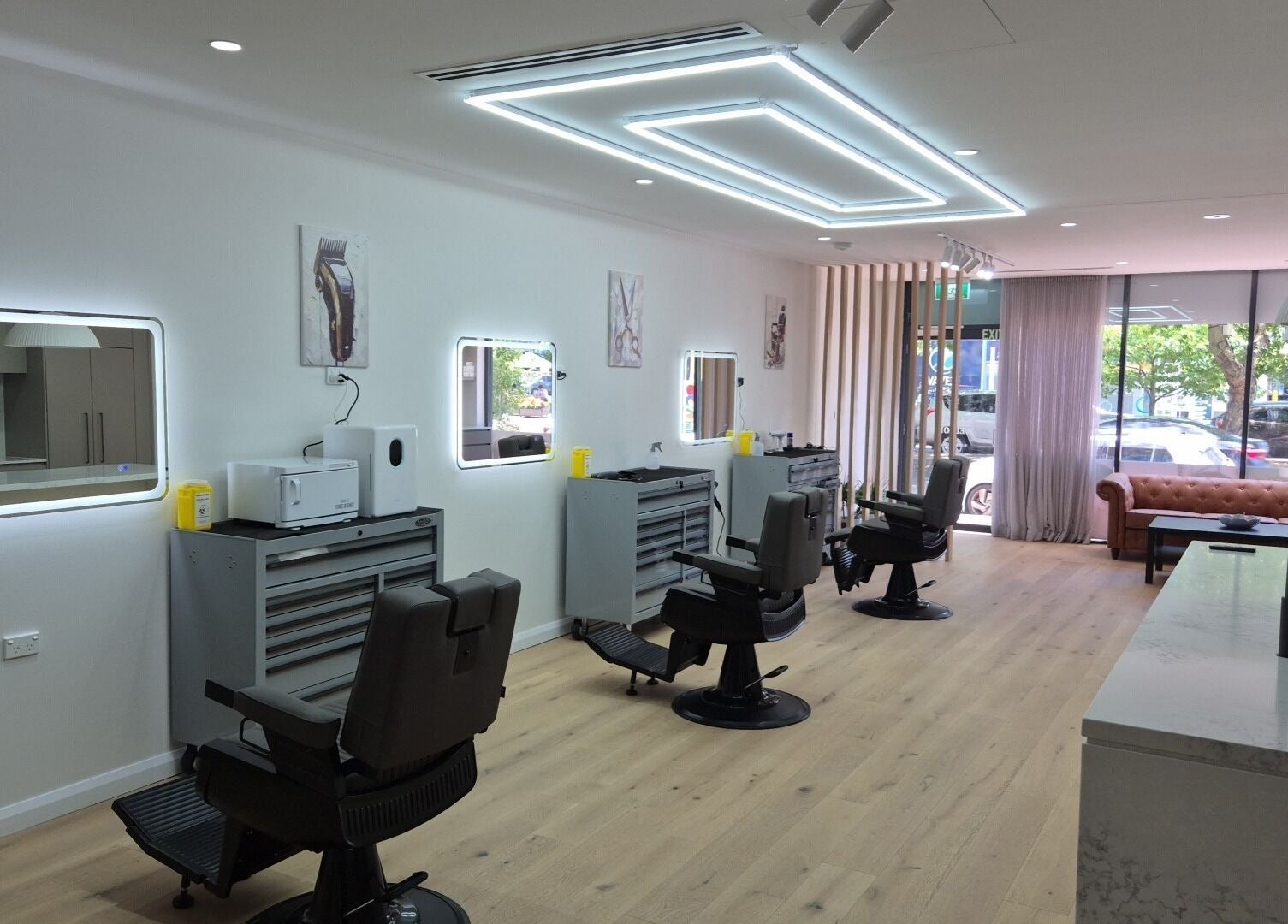 Stylish interior of THE MANUAL BARBER in Braddon, Australian Capital Territory, AU with modern barber chairs.