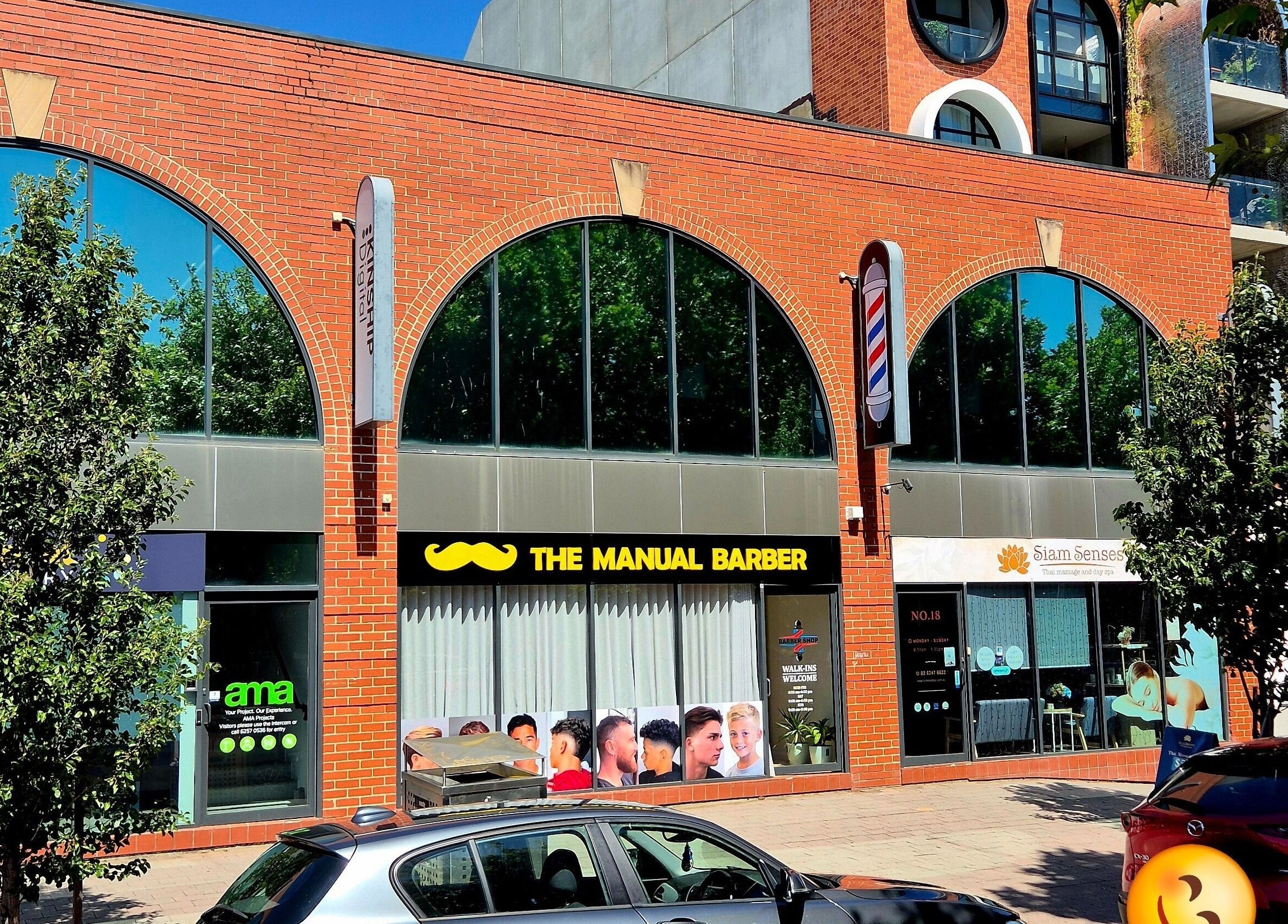 Front view of THE MANUAL BARBER at Braddon, Australian Capital Territory, AU with brick arch facade.