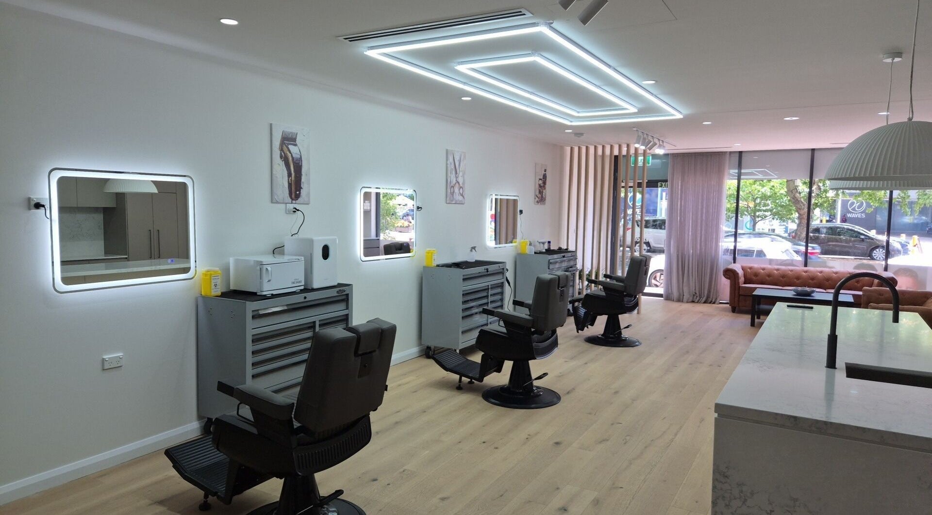 Modern barber chairs at THE MANUAL BARBER, Braddon, Australian Capital Territory, AU with sleek decor.