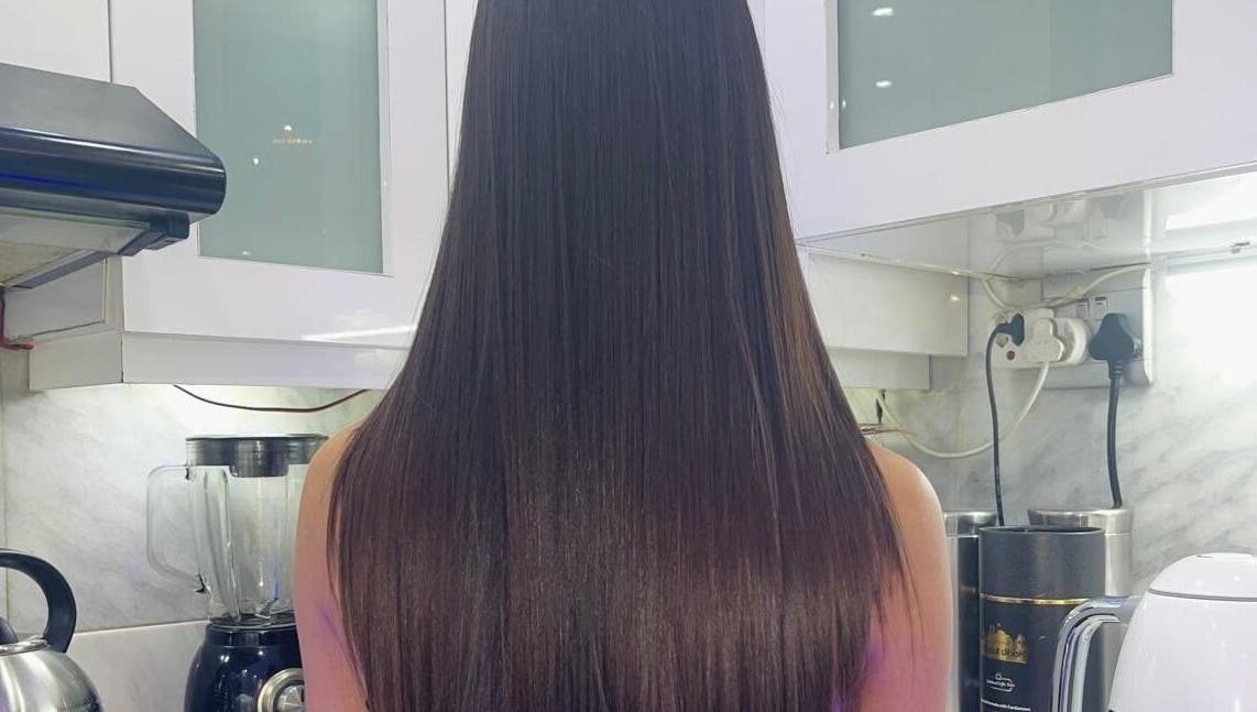 Sleek, straight hair result at Gloss Lab, Cape Town, Western Cape, ZA, showcasing salon's expertise.