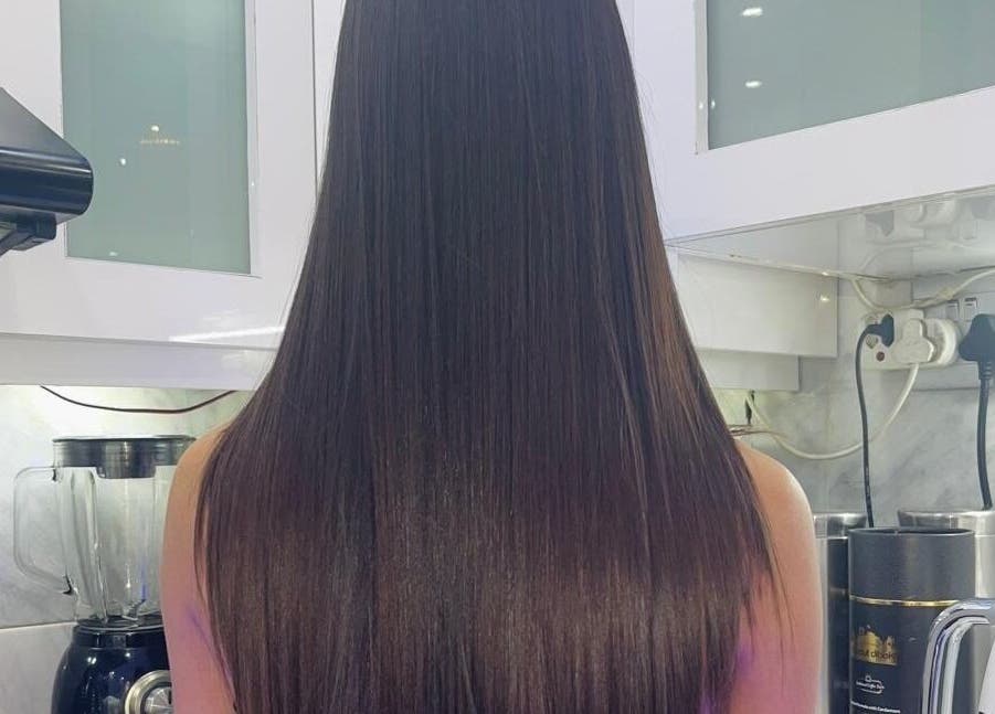 Sleek, straight hair result at Gloss Lab, Cape Town, Western Cape, ZA, showcasing salon's expertise.