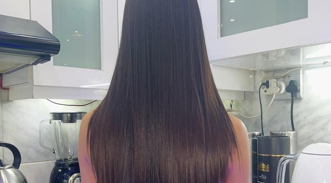 Sleek, straight hair result at Gloss Lab, Cape Town, Western Cape, ZA, showcasing salon's expertise.