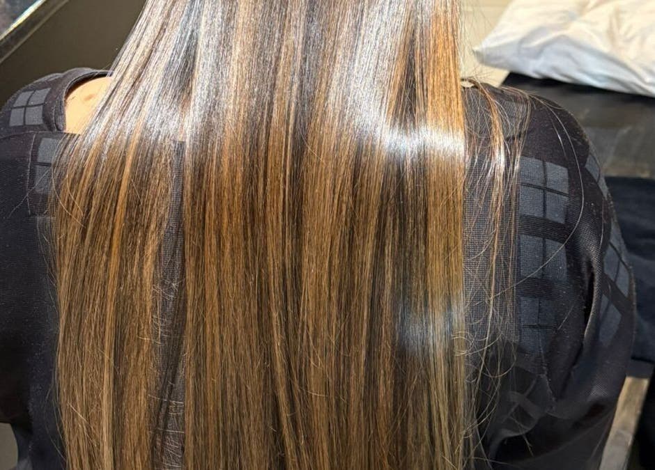 Sleek, straightened brunette hair at Gloss Lab, Cape Town, Western Cape, ZA, showcasing professional salon care.