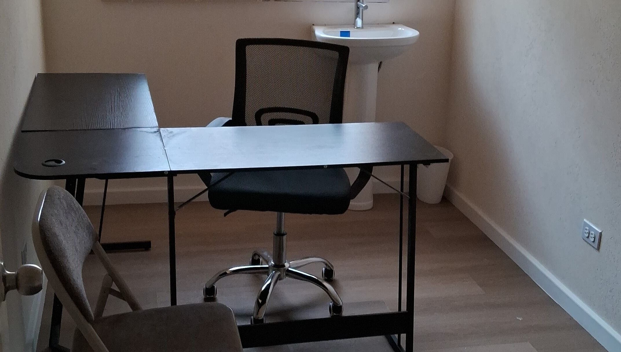 Office space with desk and chair at Dolizanel Medical, Oistins, Christ Church, BB.
