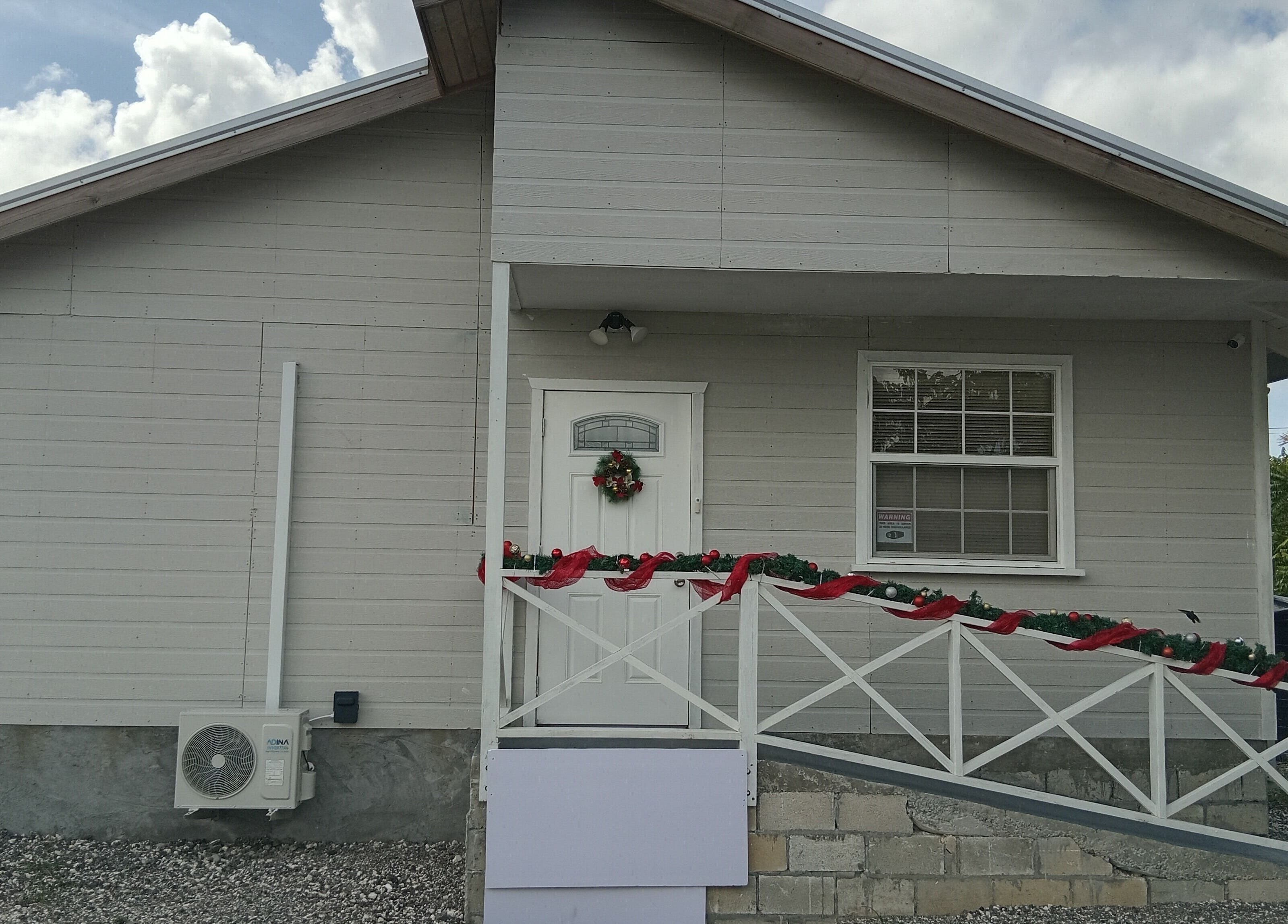 Front view of Dolizanel Medical in Oistins, Christ Church, BB, showcasing a decorative entrance.