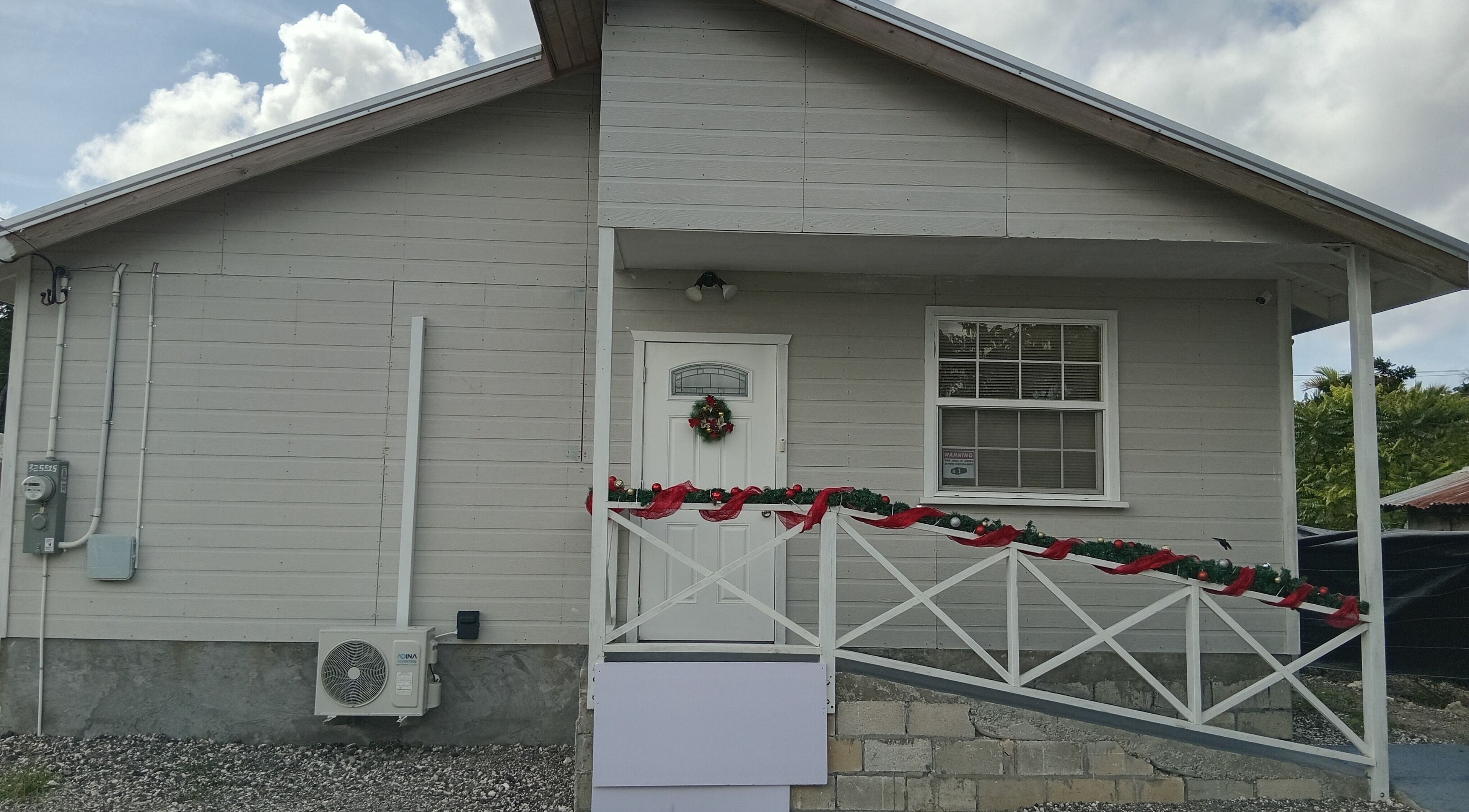 Front view of Dolizanel Medical in Oistins, Christ Church, BB, showcasing a decorative entrance.
