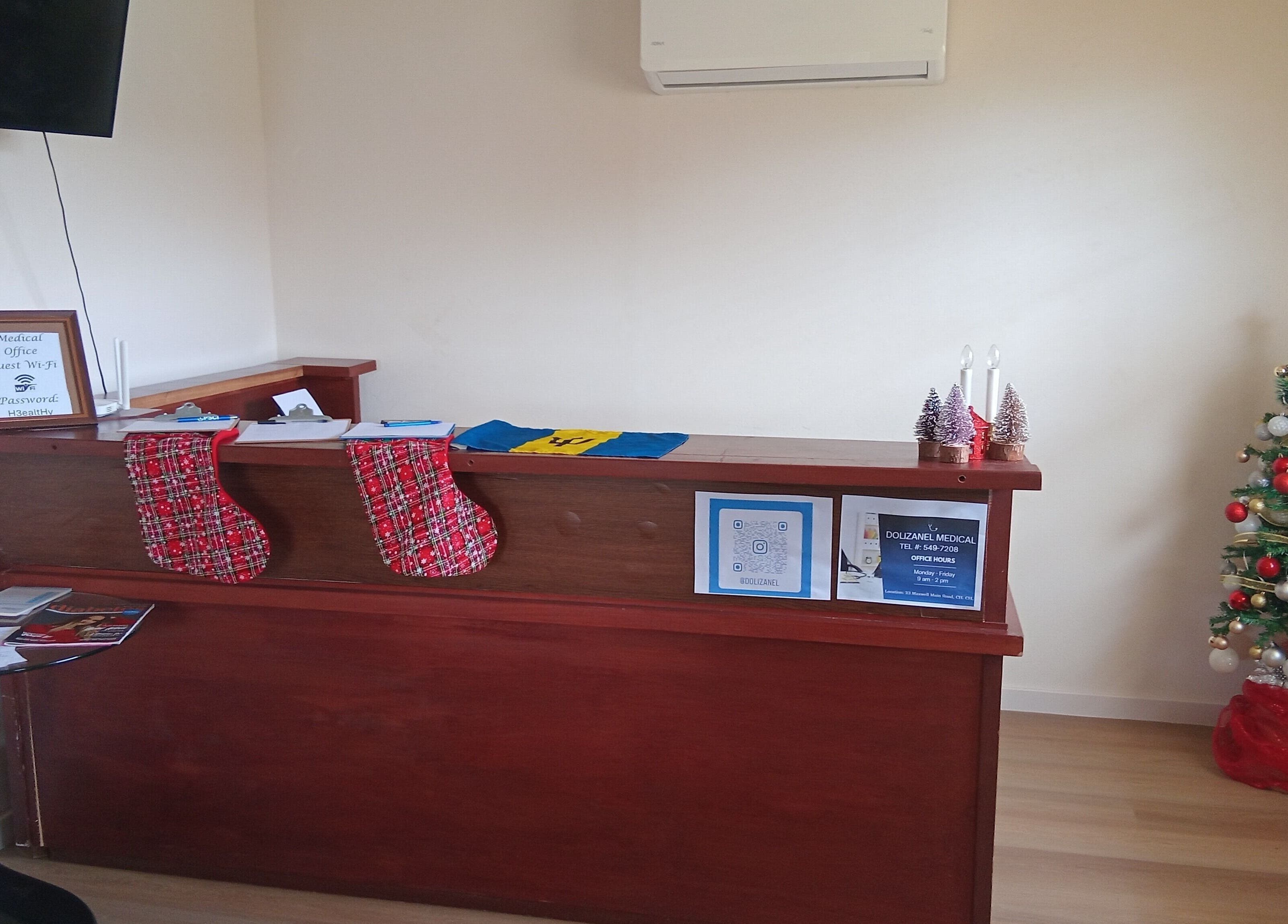 Reception area at Dolizanel Medical in Oistins, Christ Church, BB, featuring a holiday decor and a Christmas tree.