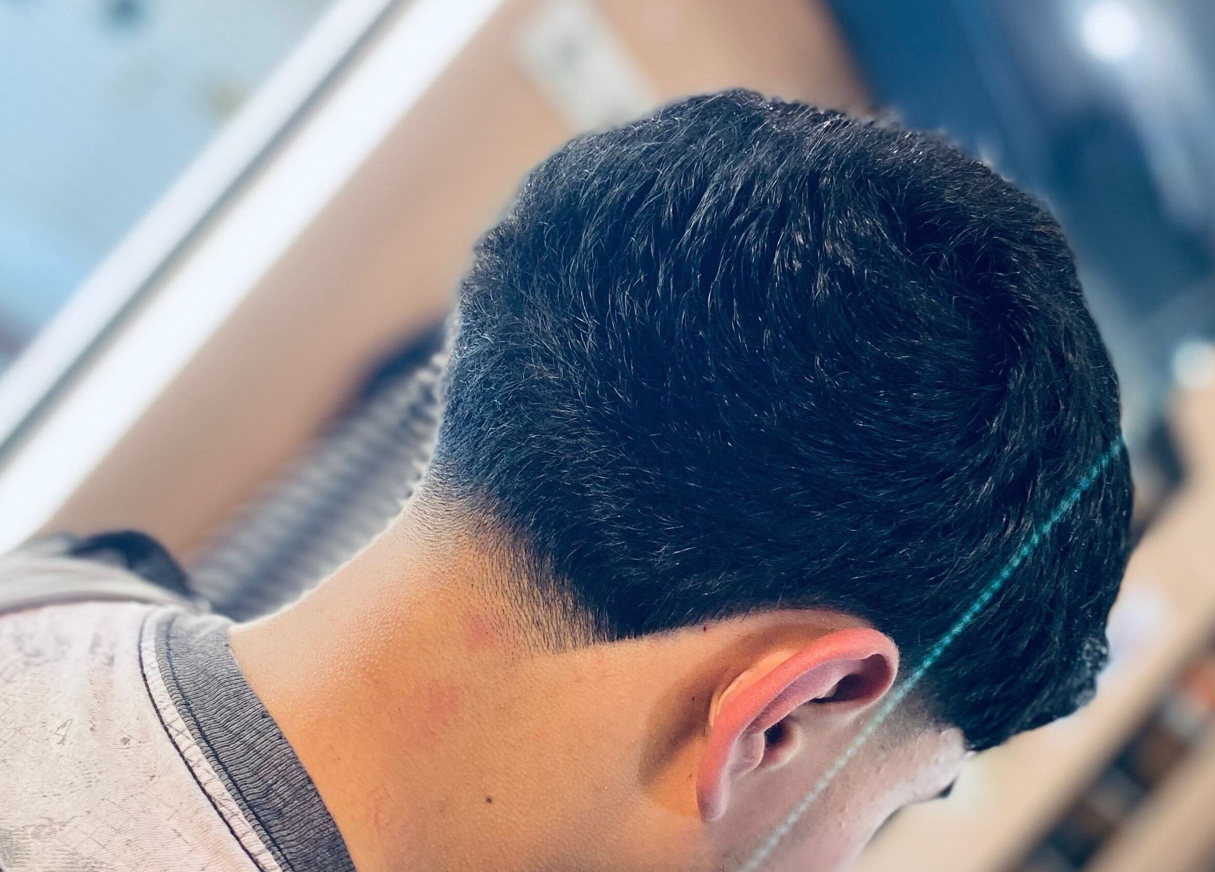 Sleek haircut at Alexy Barber💈 in Ciudad De Guatemala, Guatemala, GT