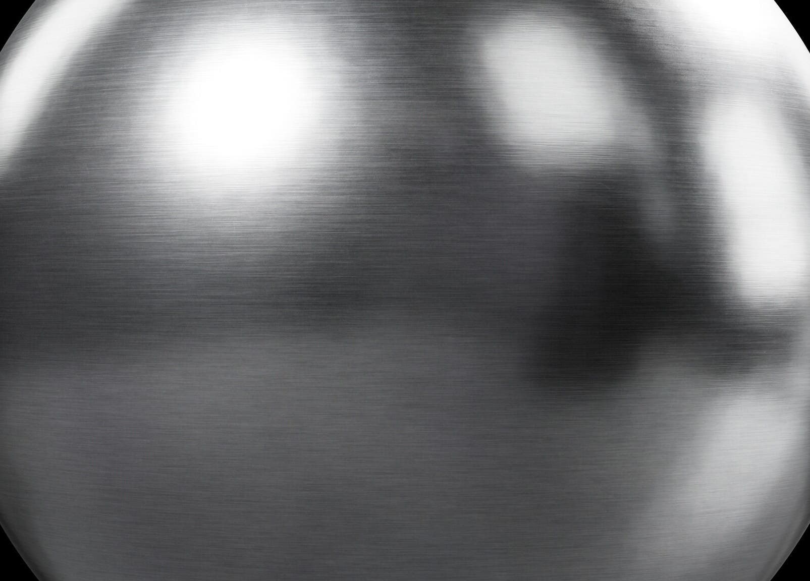 Sleek metallic sphere reflecting light at test business, Bad Mergentheim, Baden-württemberg, DE.