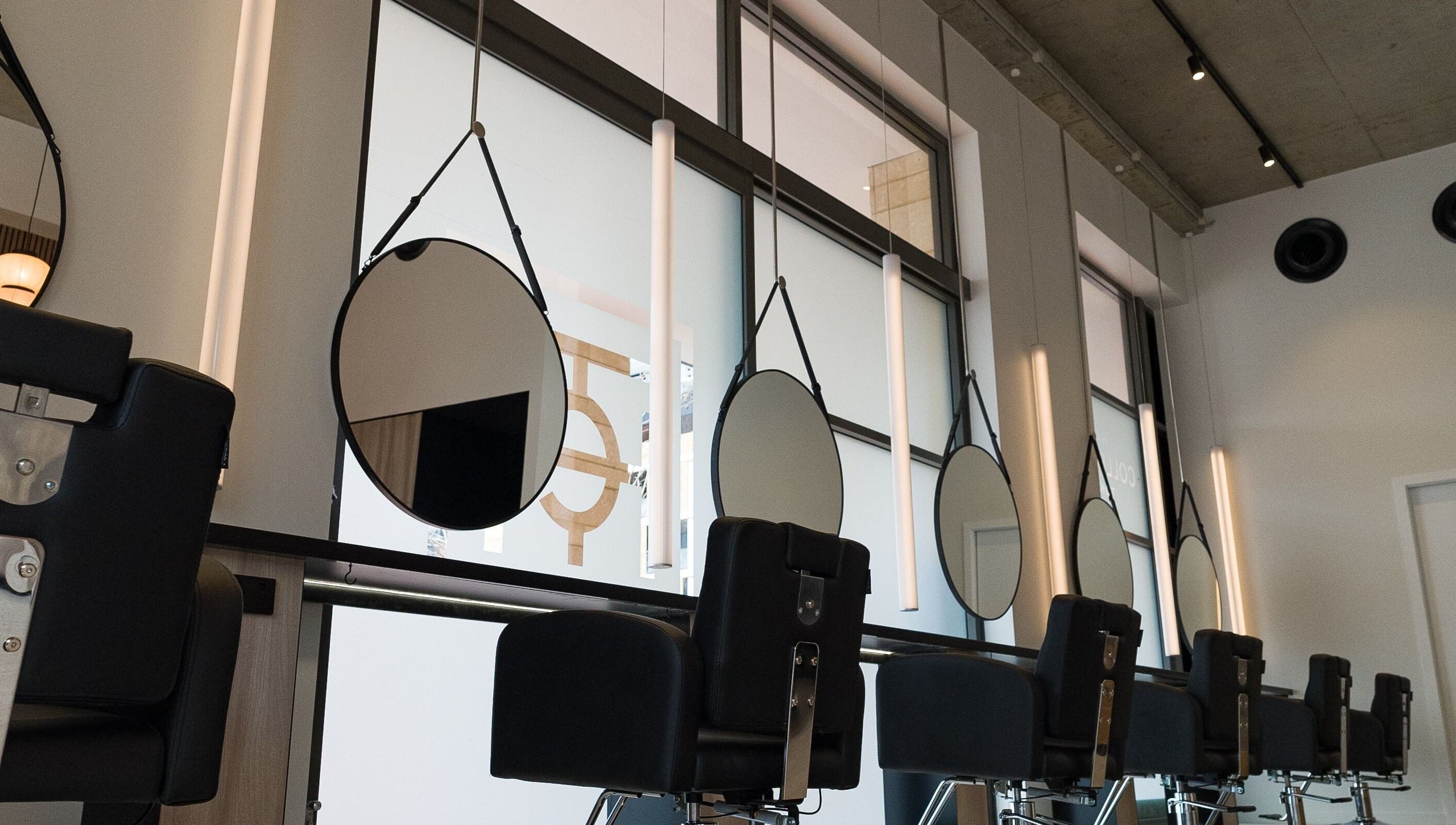 Modern salon interior with chic mirrors at Yasu, Perth, Western Australia, AU.