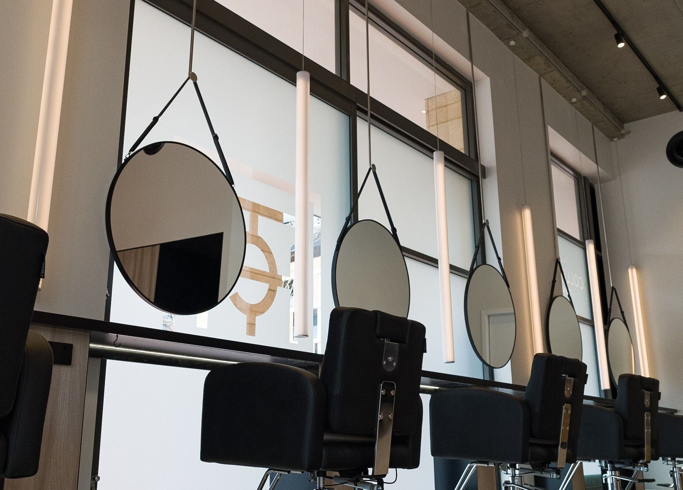 Modern salon interior with chic mirrors at Yasu, Perth, Western Australia, AU.