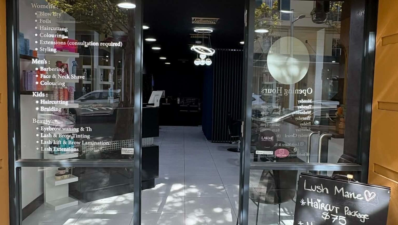 Entrance of Yasu Hair, a stylish salon in Perth, Western Australia, AU with visible service listings.