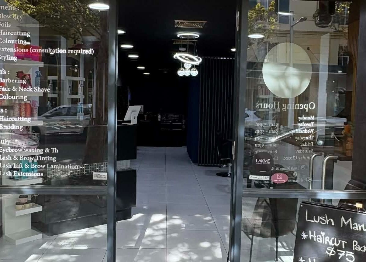 Entrance of Yasu Hair, a stylish salon in Perth, Western Australia, AU with visible service listings.