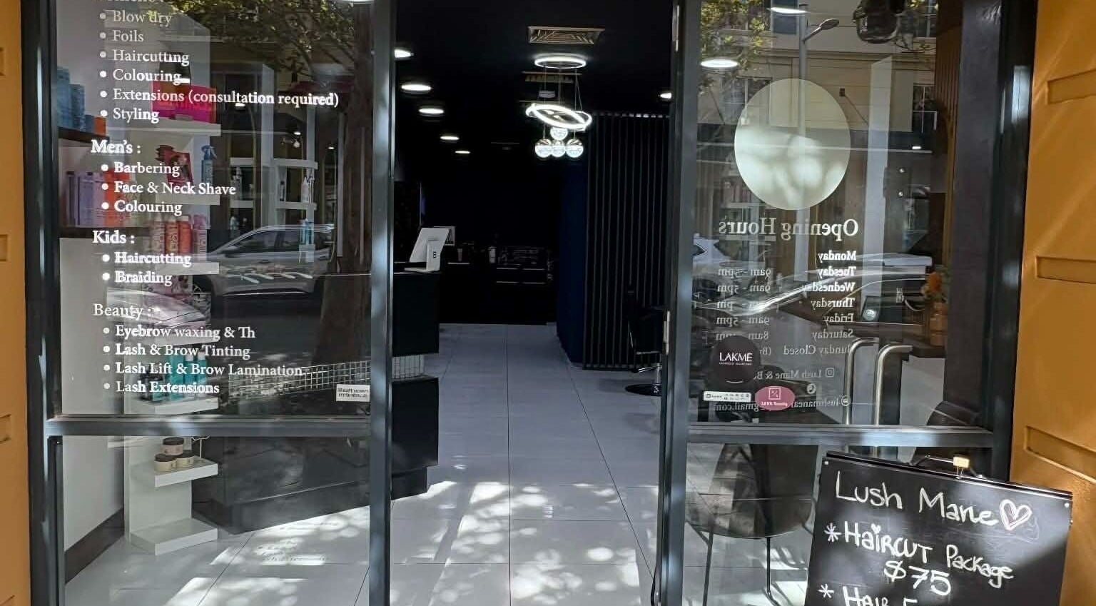 Entrance of Yasu Hair in Perth, Western Australia, AU showcasing service list and inviting ambiance.