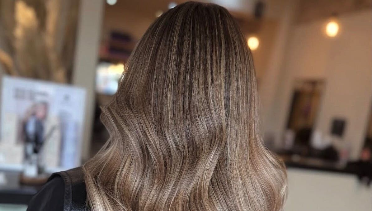 Beautiful brown hair styled at Emily White Hair, Forest Hall, England, GB, showcasing glossy waves.