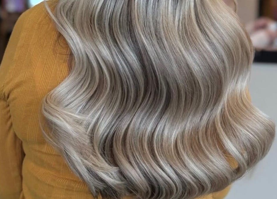 Elegant silver wavy hairstyle at Emily White Hair, Forest Hall, England, GB.