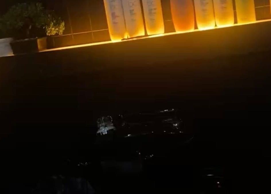 Backlit shelf with hair products at Emily White Hair, Forest Hall, England, GB, creating a warm ambiance.