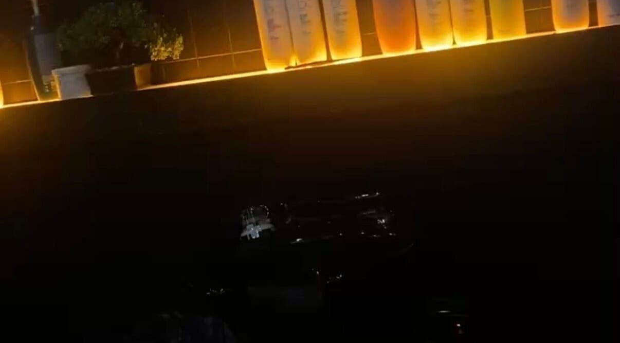 Backlit shelf with hair products at Emily White Hair, Forest Hall, England, GB, creating a warm ambiance.