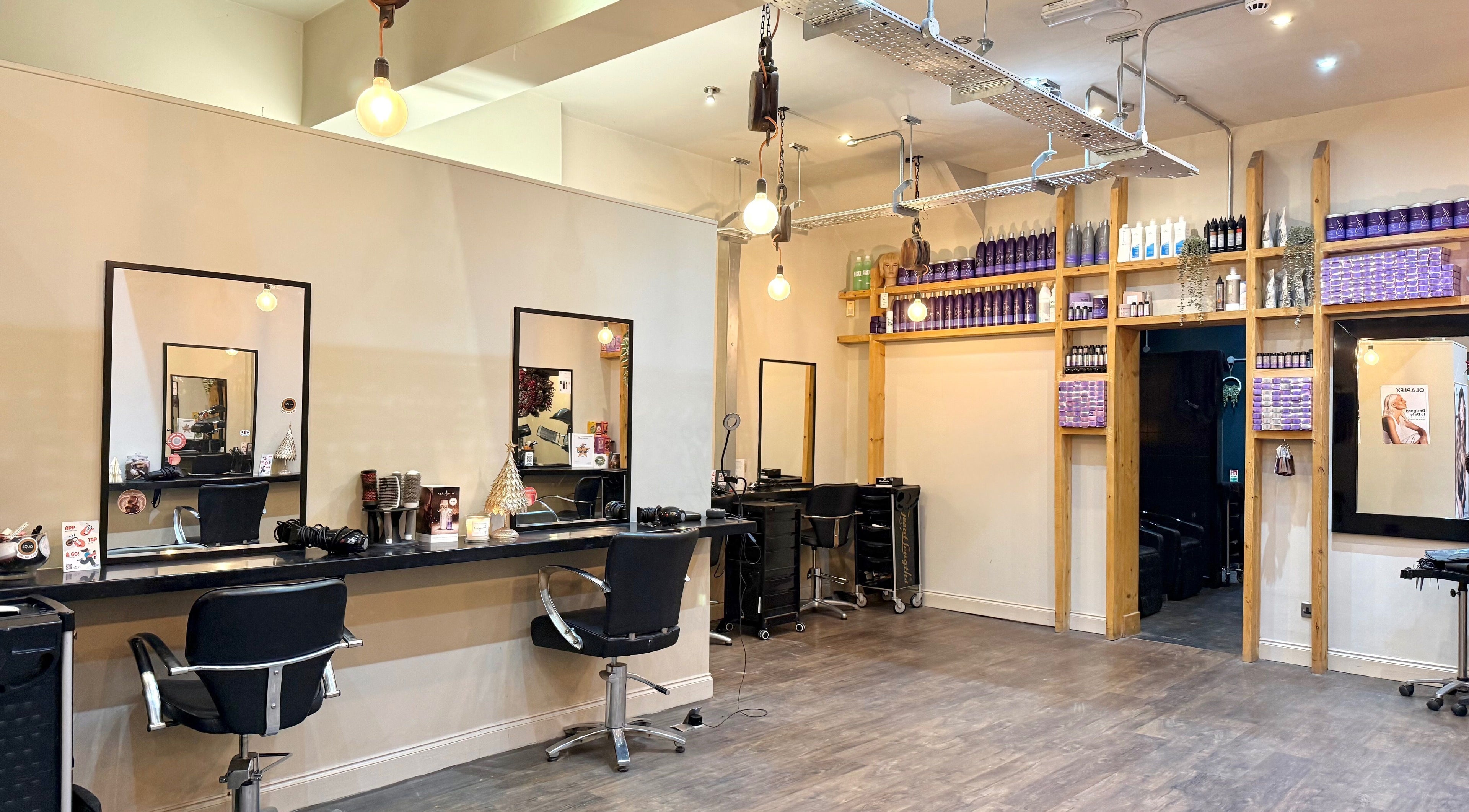 Elegant styling stations at Emily White Hair, Forest Hall, England, GB showcasing modern decor and products.