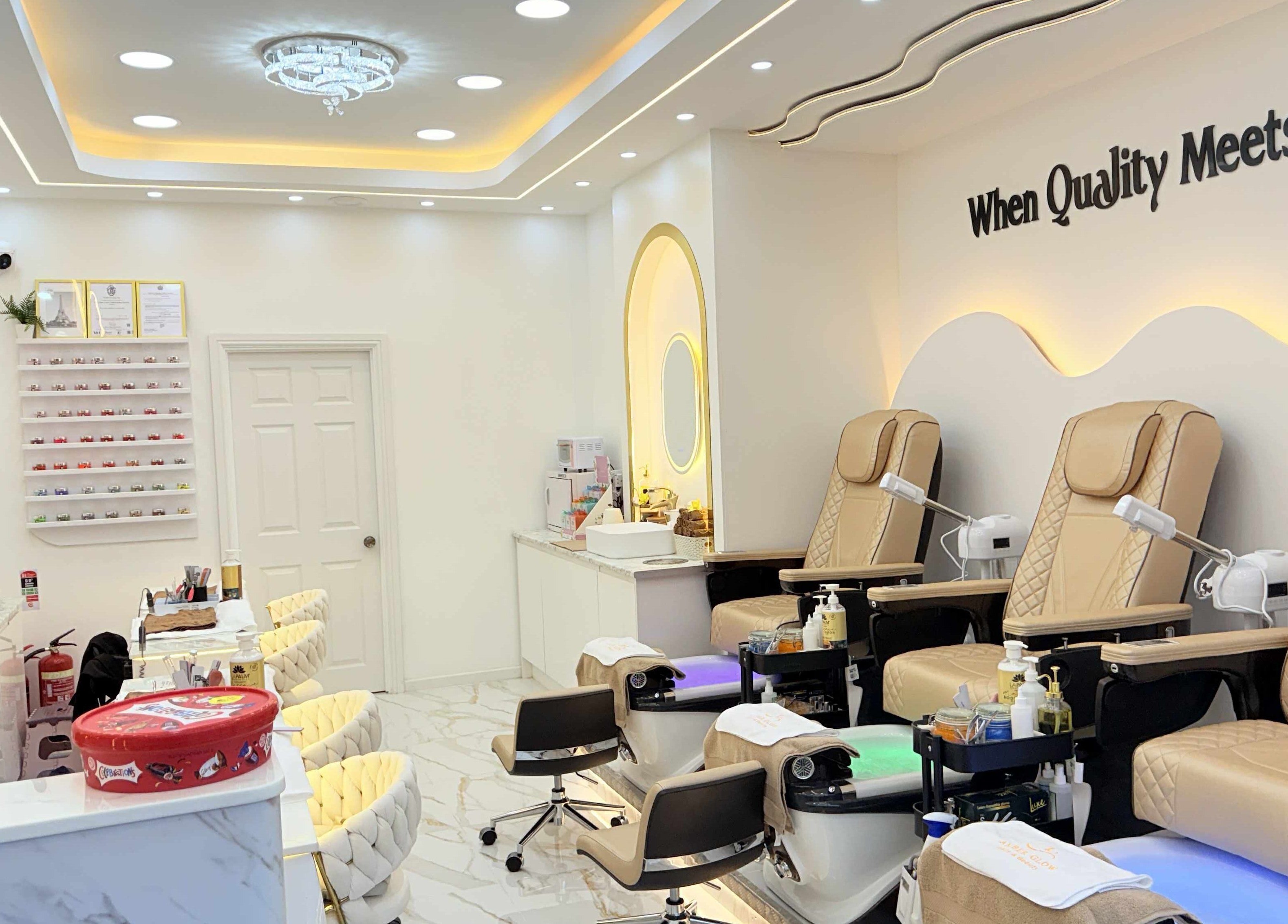 Amber Glow Nails & Beauty, London, England, GB: luxurious nail salon with plush seating and modern décor.
