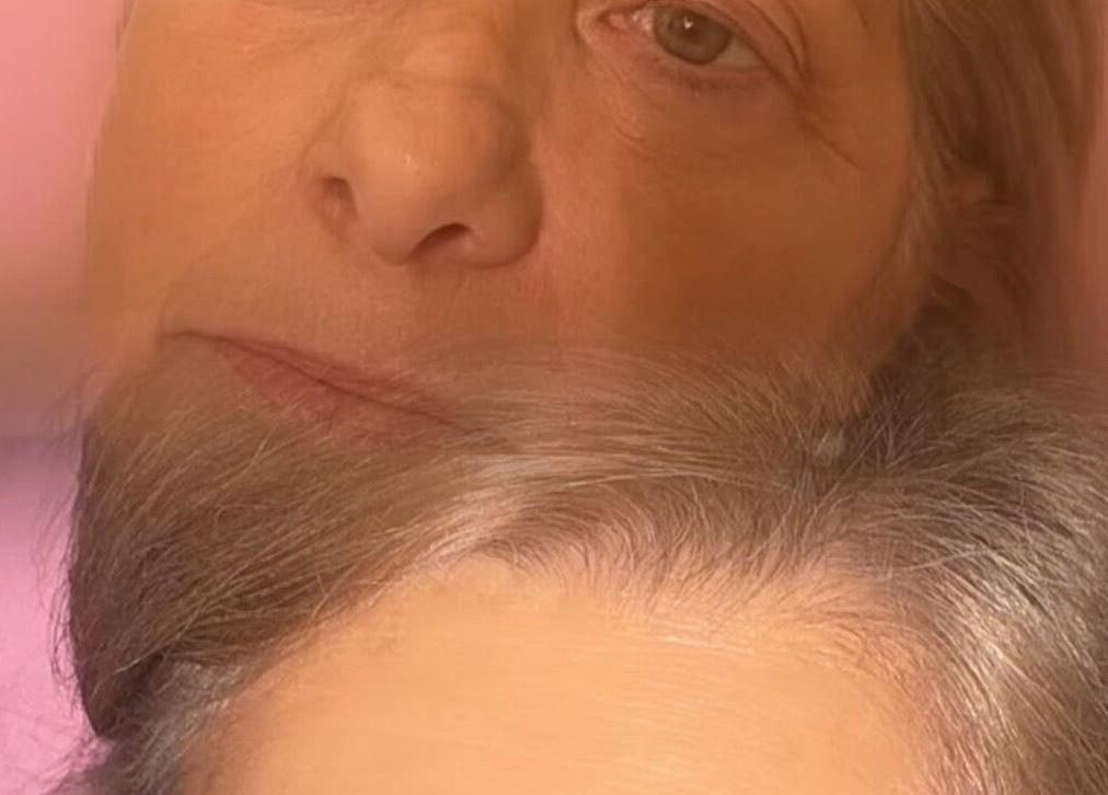 Close-up portrait capturing relaxation at Doll Faced, GB, showcasing subtle elegance and calmness.