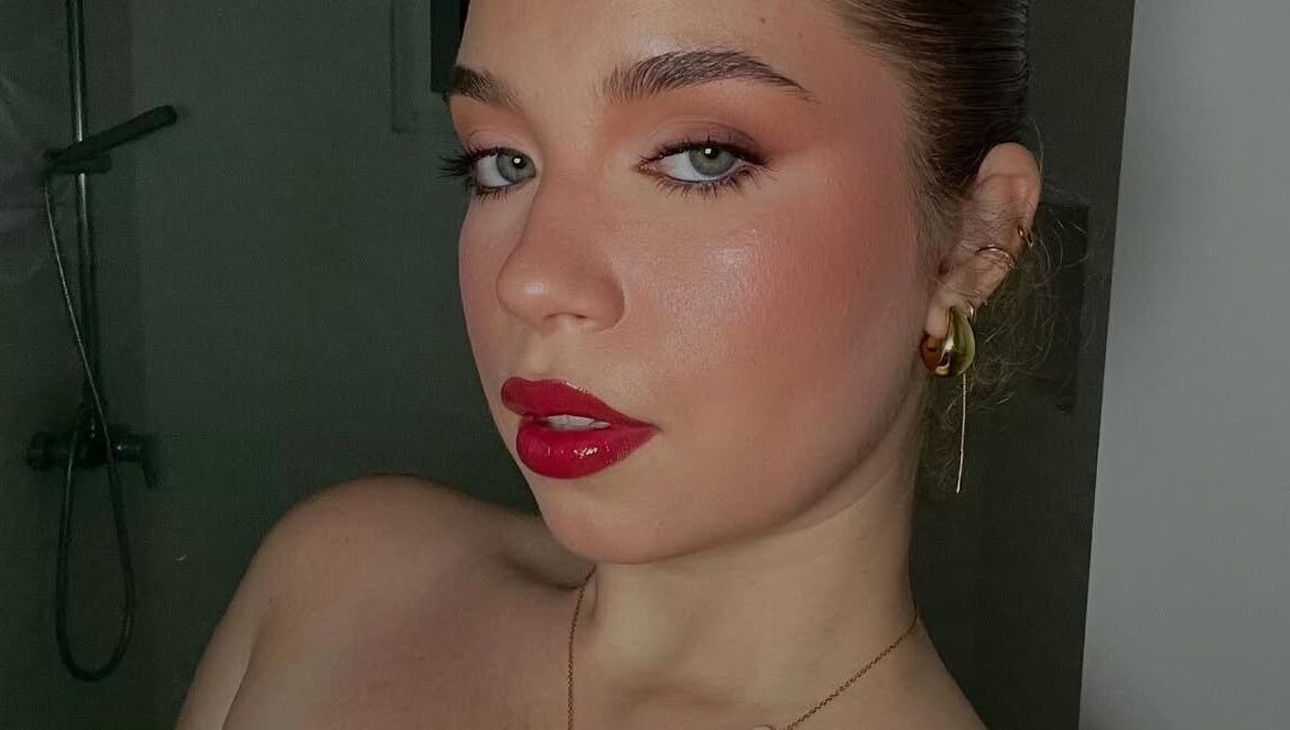 Elegant makeup by Makeup by Yageiry in Jarabacoa, La Vega Province, DO showcasing bold red lips.