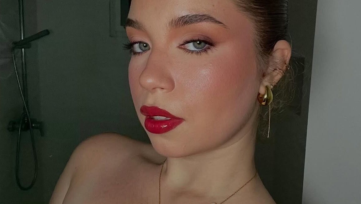 Elegant makeup by Makeup by Yageiry in Jarabacoa, La Vega Province, DO showcasing bold red lips.