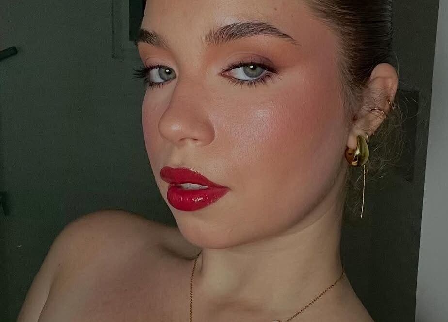 Elegant makeup by Makeup by Yageiry in Jarabacoa, La Vega Province, DO showcasing bold red lips.
